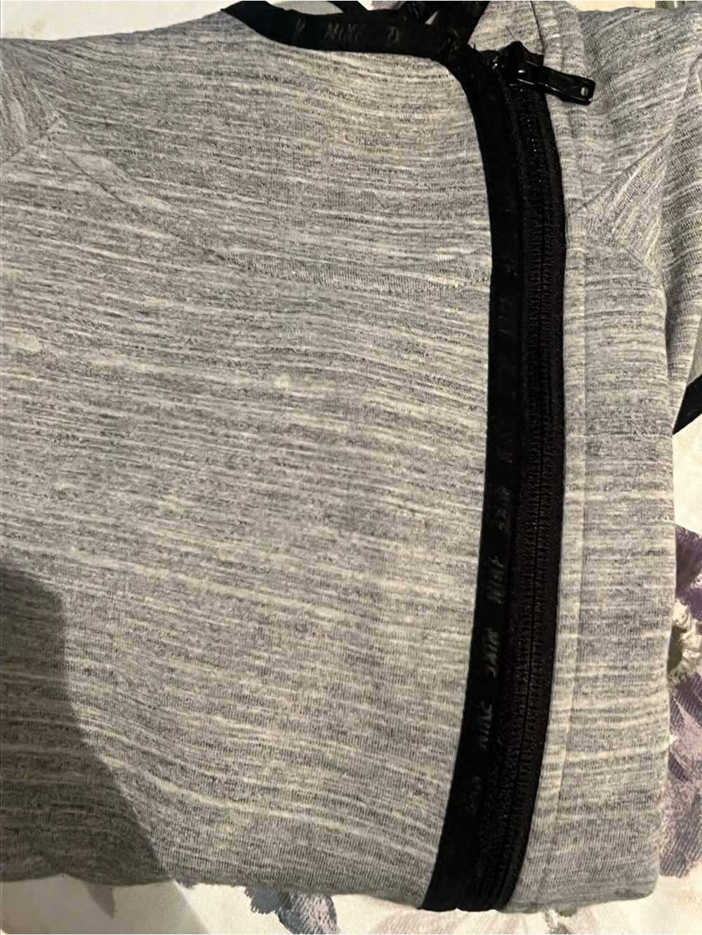 Nike Red & White Logo Patch on Gray Fabric